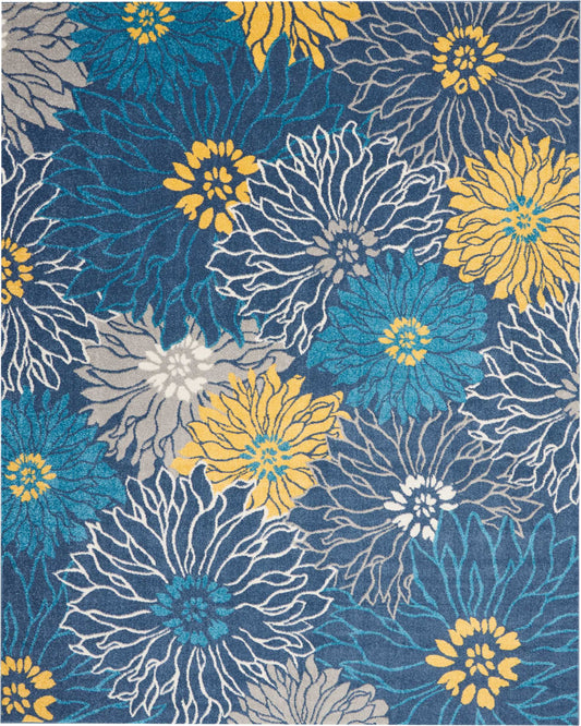 Oversized teal, yellow, gray and white floral rug with bold petal outlines on a navy background; modern tropical style.
