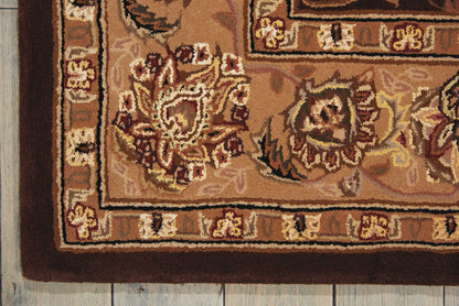 Traditional oriental area rug in warm browns and beiges with floral medallions; rectangular rug on a wooden floor.