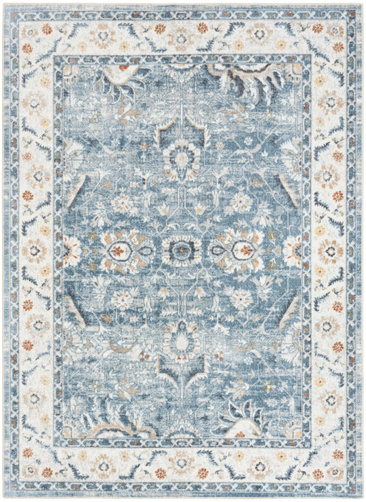 Rectangular blue distressed oriental area rug with ivory floral border and central medallion.