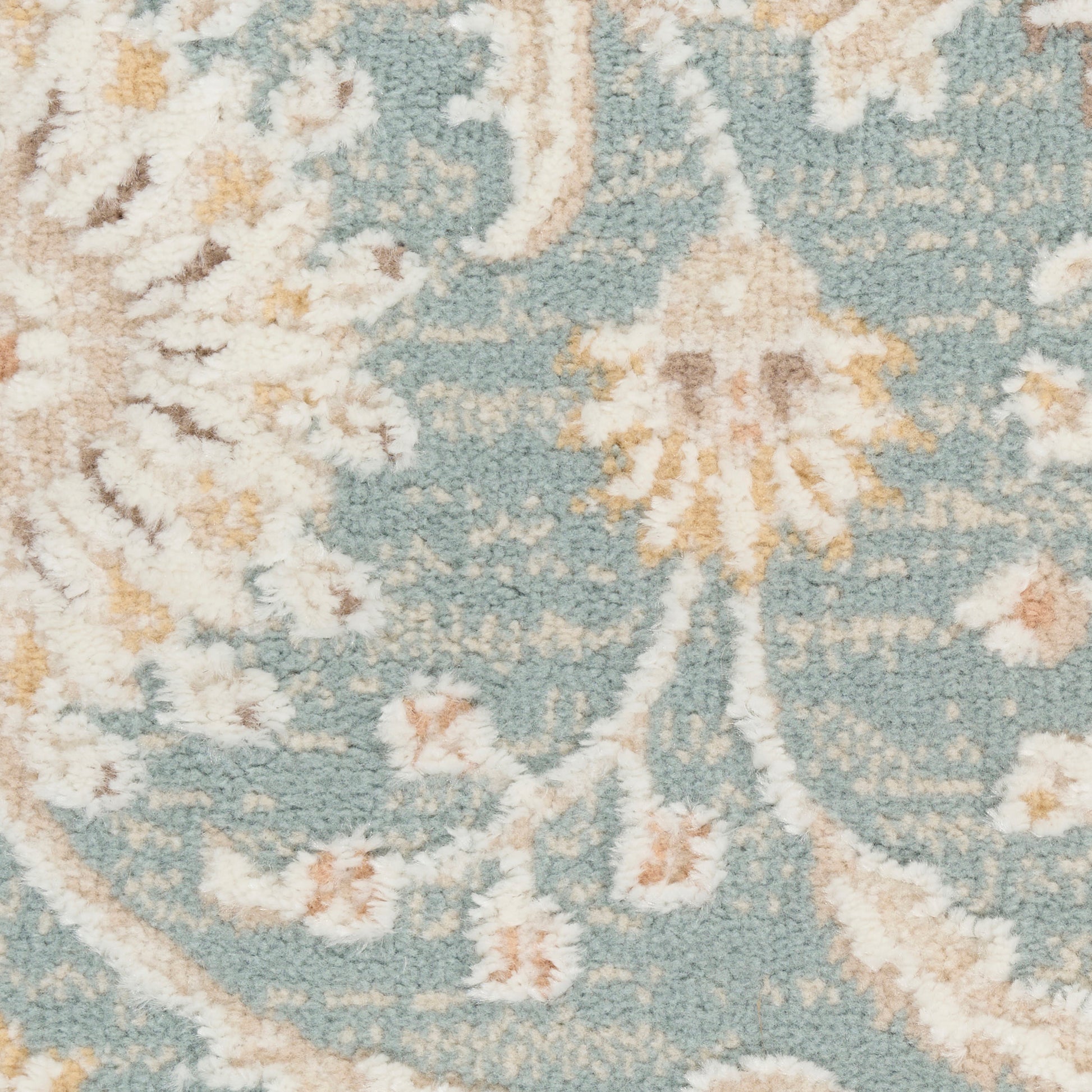 Turquoise blue area rug with cream and pale yellow floral damask pattern, woven texture, soft and decorative.