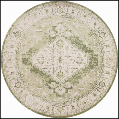 Round vintage-style rug in muted olive and beige tones with a central diamond medallion and intricate floral border.