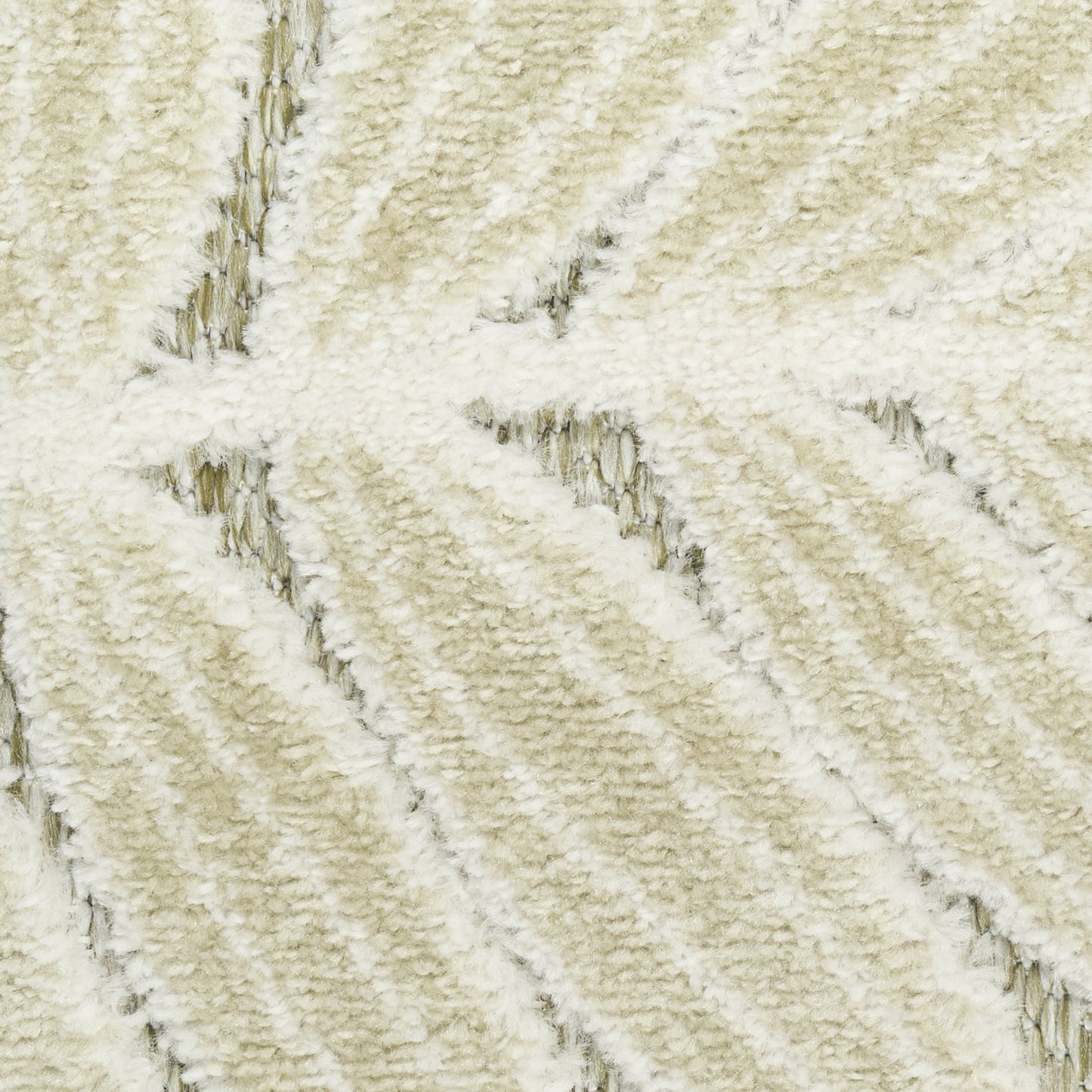 Cream plush rug close-up with diagonal ribbed pattern and soft shag texture.