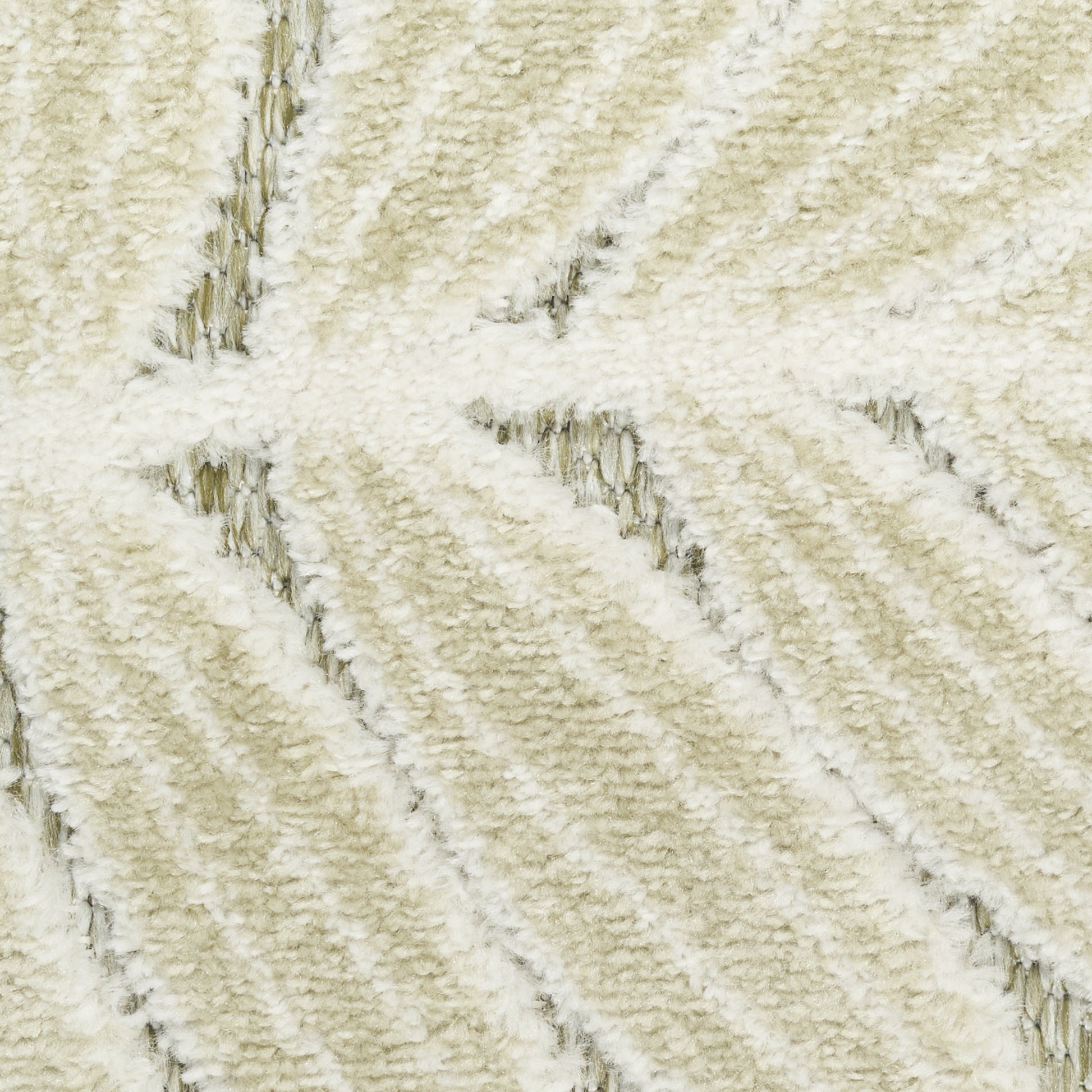 Cream plush rug close-up with diagonal ribbed pattern and soft shag texture.