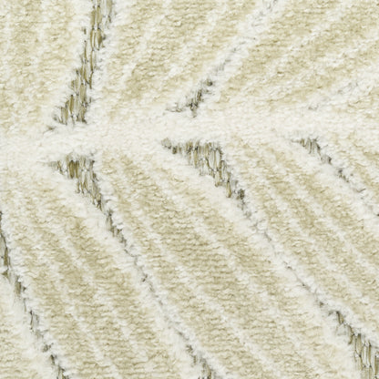 Cream plush rug close-up with diagonal ribbed pattern and soft shag texture.