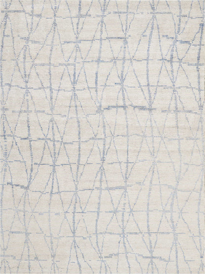 Cream textured rug with a pale blue geometric lattice pattern of diamonds and lines.