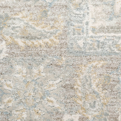 Neutral area rug with an abstract oriental motif in beige, gray, pale yellow, and light blue.