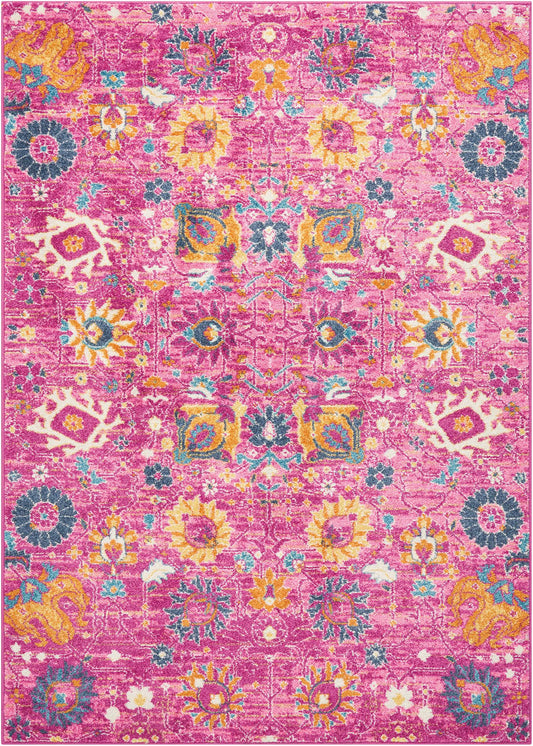 Rectangular pink distressed rug with yellow, teal, blue & orange floral medallions in a Persian-inspired pattern.
