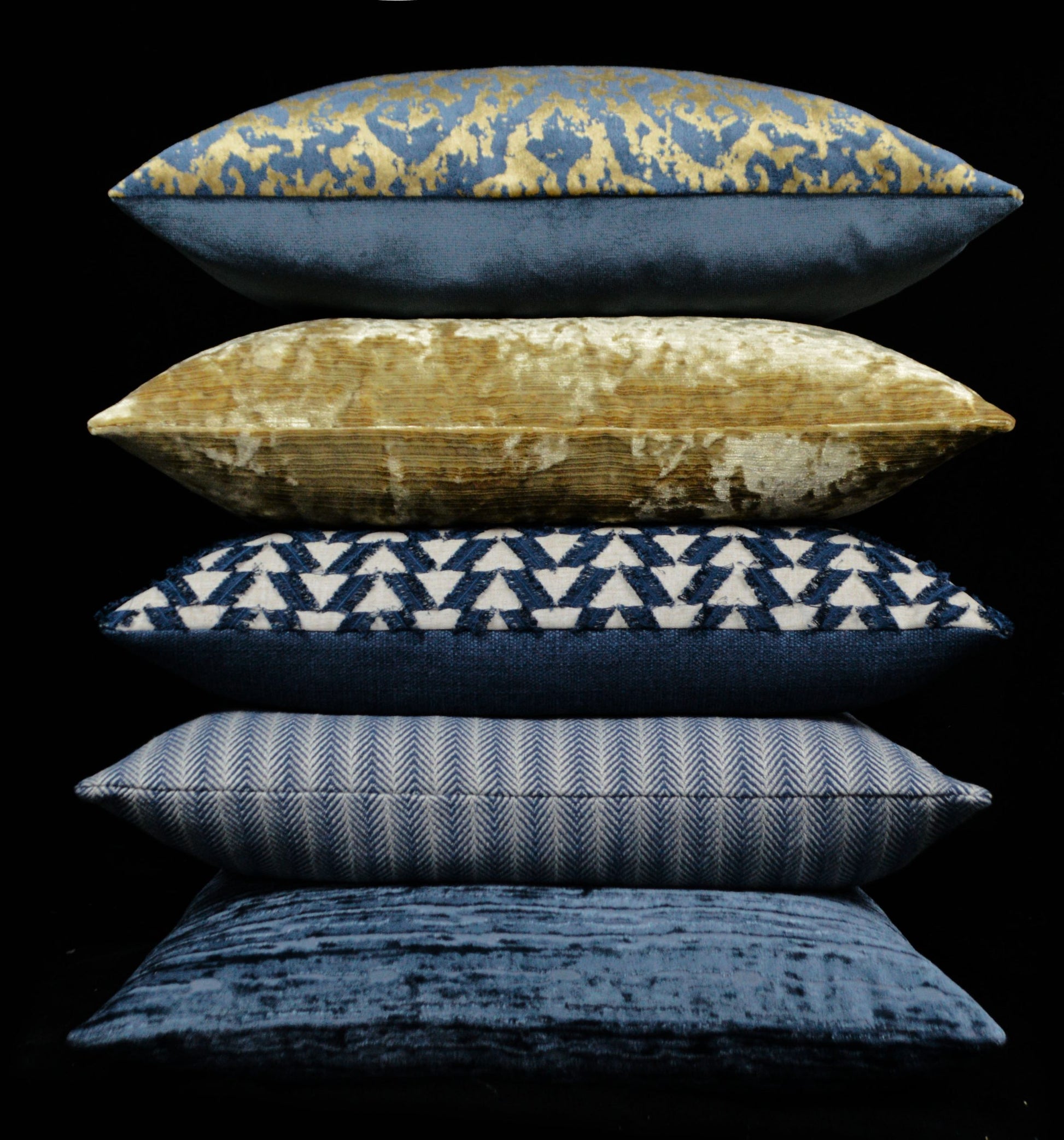 24" x 24" throw pillow in indigo and mustard tones with velvet, geometric pattern.