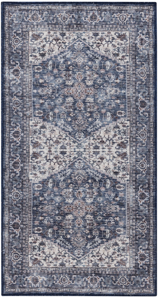 Distressed blue Persian-style area rug with ivory center and ornate floral medallions.