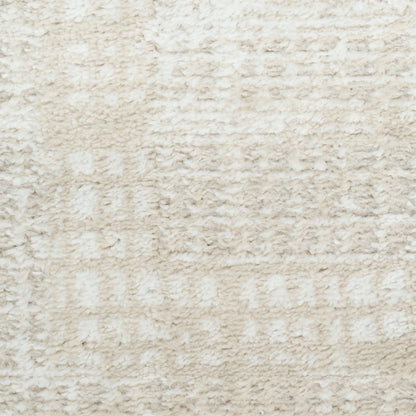 Cream beige shag rug with soft, plush pile and subtle textured geometric pattern.
