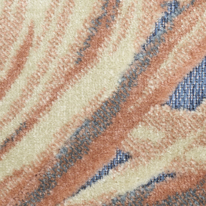 Close-up of a plush beige rug with peach, cream, and blue wavy stripes, high-pile texture for cozy living spaces.
