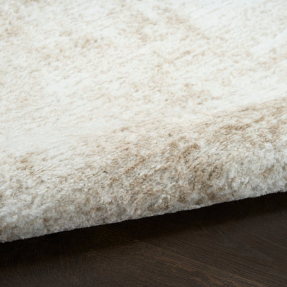 Cream shag rug with dense, plush pile resting on dark wood floor.