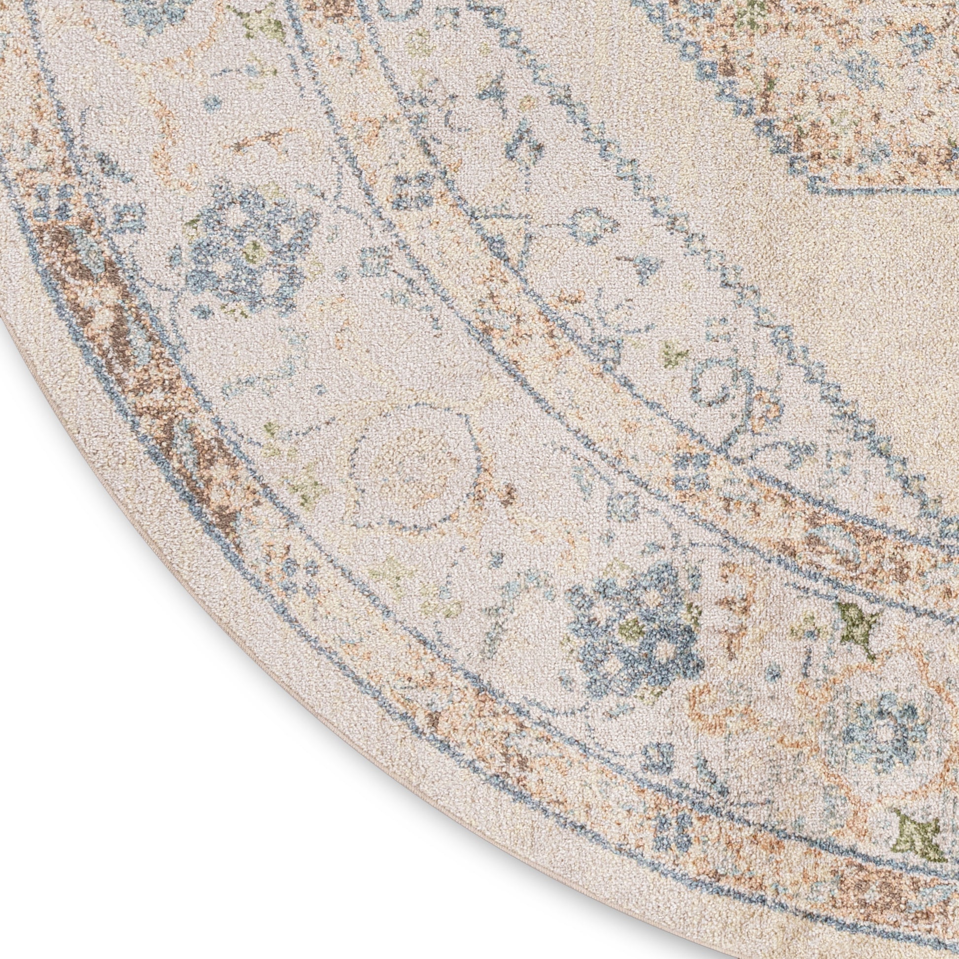 Round beige rug with blue and tan floral borders, soft pile, vintage-inspired decorative rug.