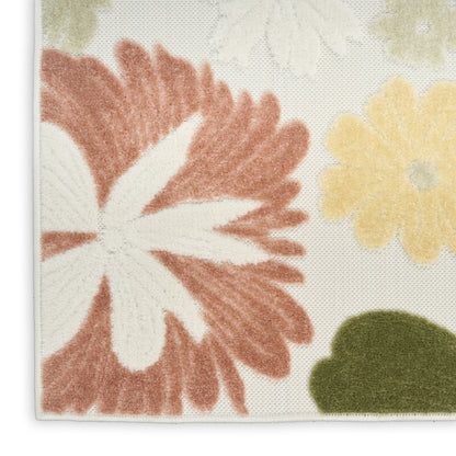 Tufted floral rug: large pink-red petals with white center, pale yellow flower, and green leaf on a light background.