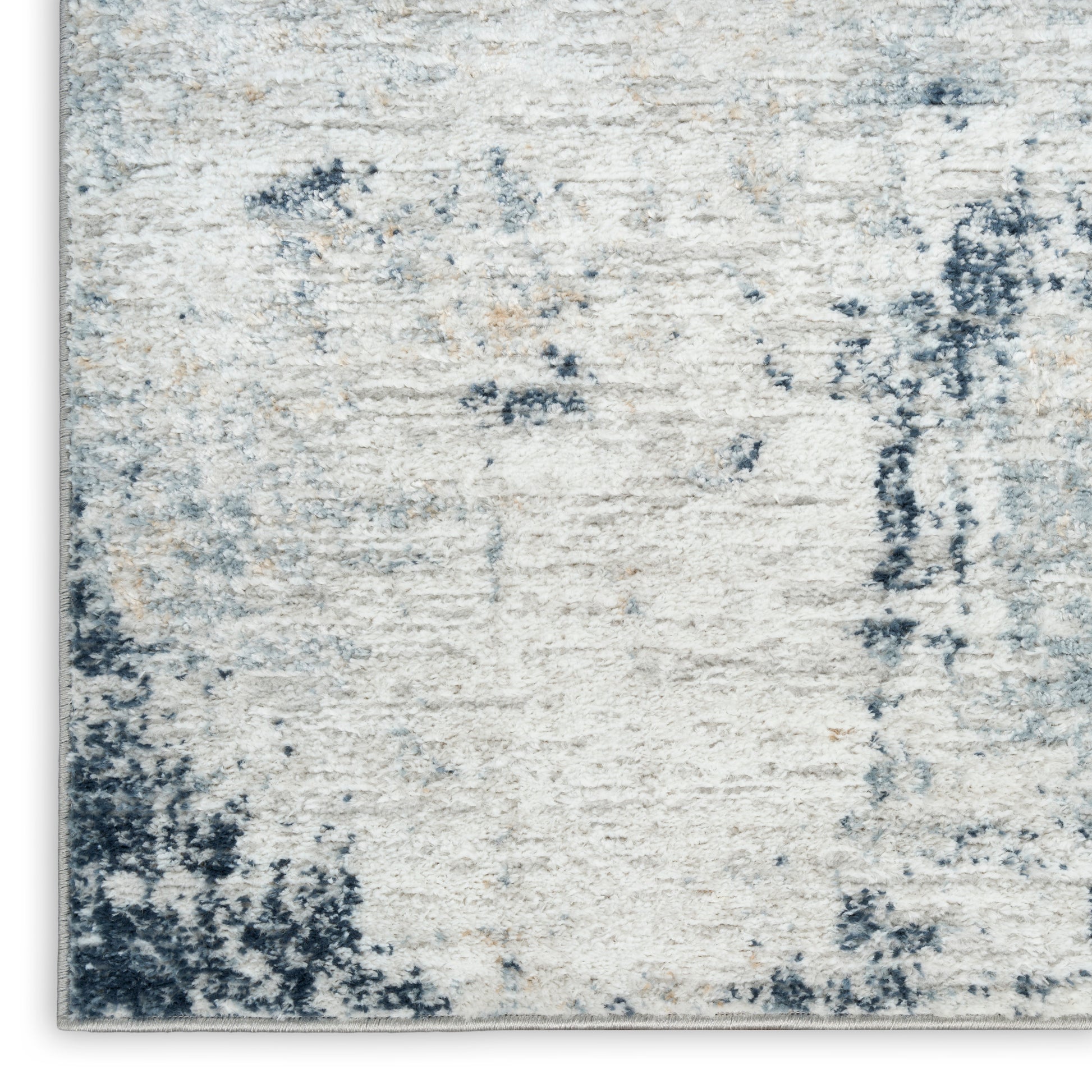 Ivory and blue abstract area rug with distressed pattern and plush pile, modern contemporary style.