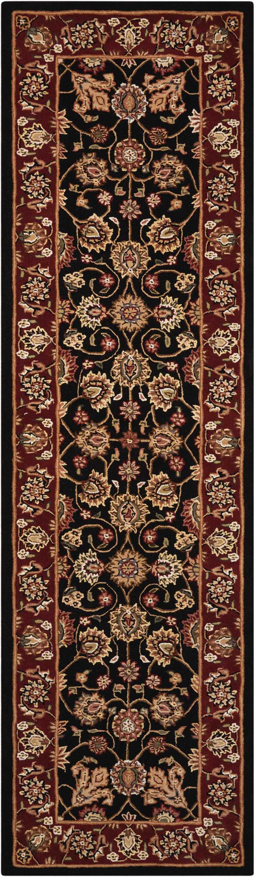 Persian-style long runner rug with black central field, gold and pink floral vines, ornate red borders.
