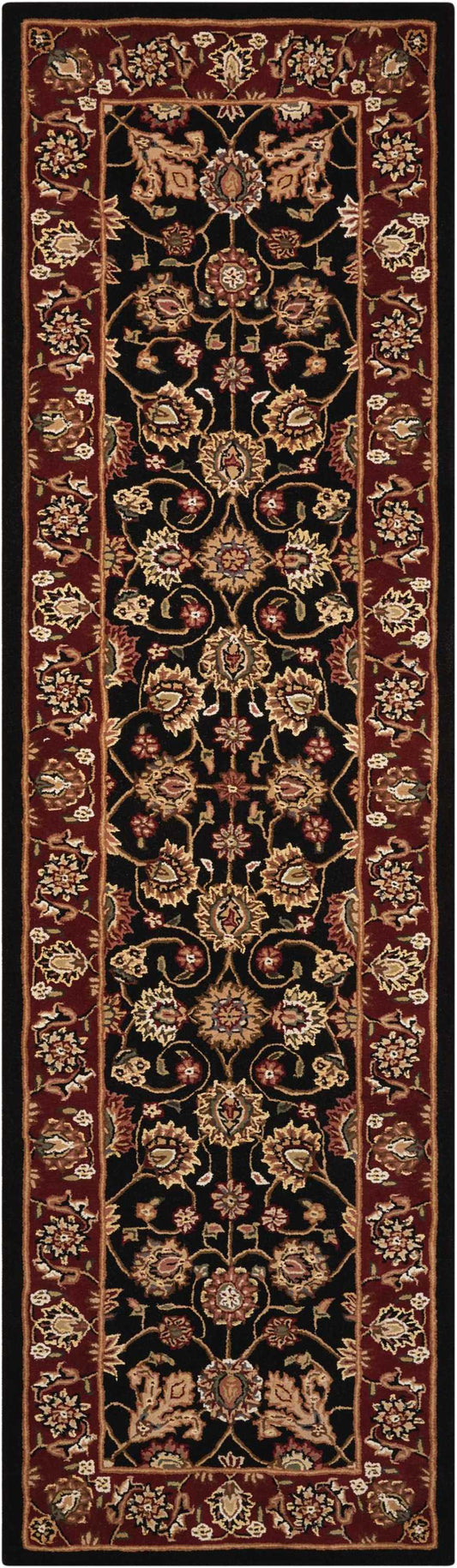 Persian-style long runner rug with black central field, gold and pink floral vines, ornate red borders.