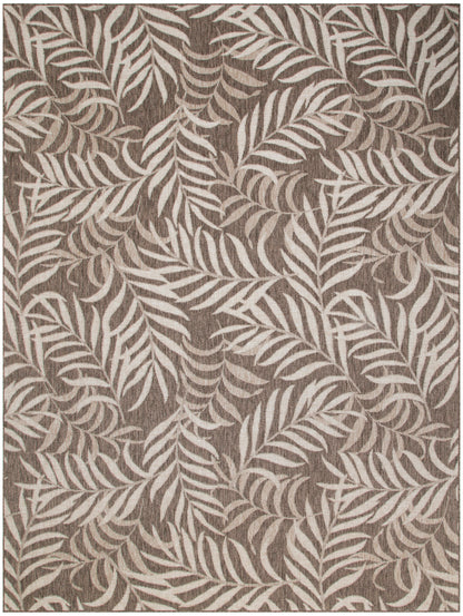 Taupe rectangular rug with cream tropical leaf pattern and woven texture for living room decor.