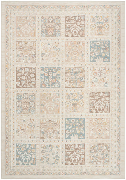 Pastel patchwork rug with square floral blocks in beige, cream, blue, and brown; decorative border.