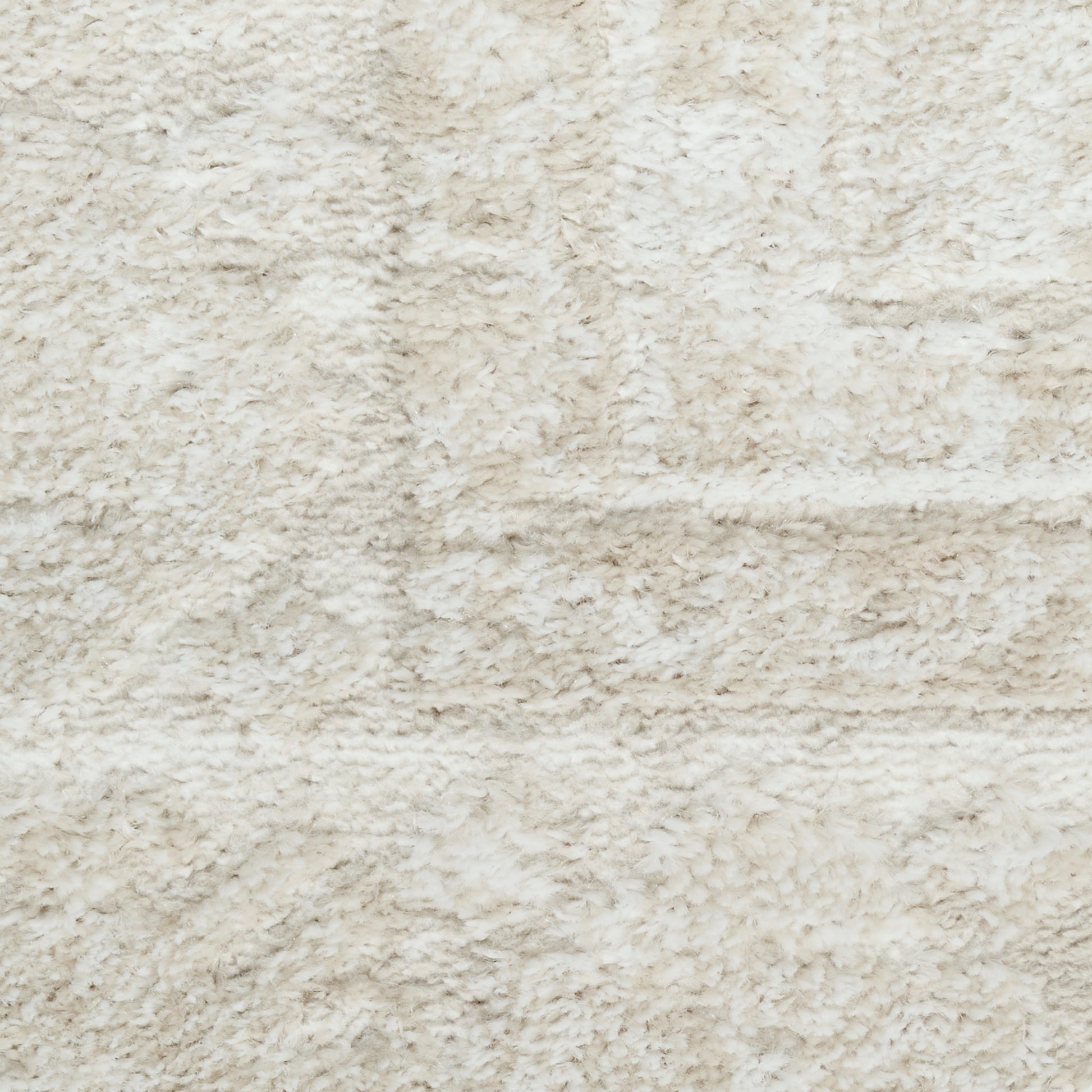 Cream shaggy rug close-up with plush beige fibers, soft texture for living room decor.