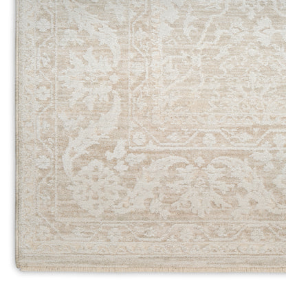 Cream-beige oriental rug with pale ivory faded motif and vintage floral border; fringe edge.