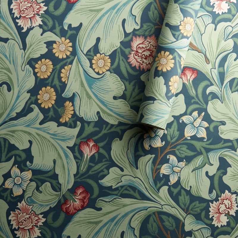 Morris & Co. Leicester Wallpaper in Woad/Sage featuring elegant arching leaves and mid-scale floral blooms designed by John Henry Dearle in 1912. Inspired by the Bachelors Button pattern, this Arts & Crafts designer wallpaper is ideal for feature walls, living rooms, bedrooms, dining rooms, hallways, English cottage, traditional, vintage, and heritage-inspired interiors.