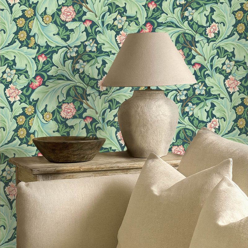Morris & Co. Leicester Wallpaper in Woad/Sage featuring elegant arching leaves and mid-scale floral blooms designed by John Henry Dearle in 1912. Inspired by the Bachelors Button pattern, this Arts & Crafts designer wallpaper is ideal for feature walls, living rooms, bedrooms, dining rooms, hallways, English cottage, traditional, vintage, and heritage-inspired interiors.