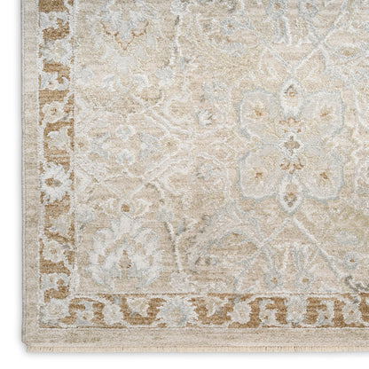 Light beige area rug with cream floral motifs and a tan decorative border; classic oriental style.