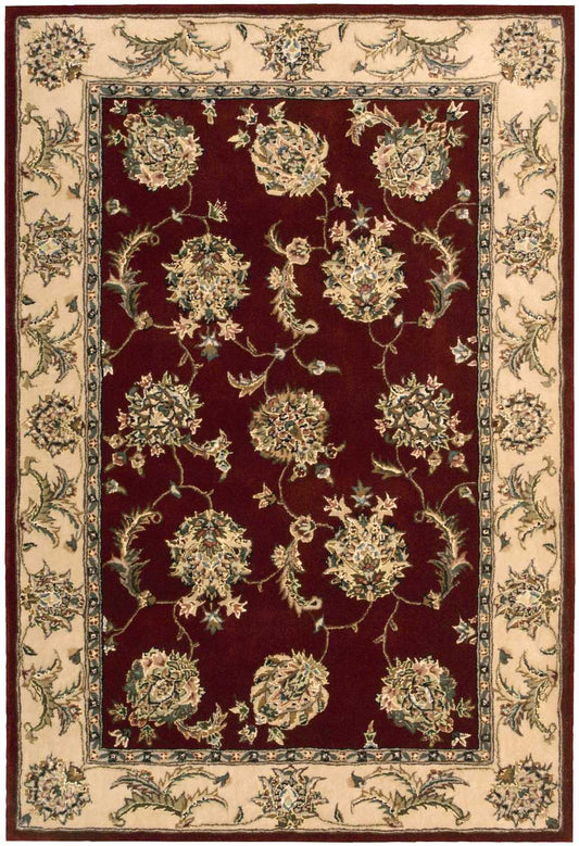 Rectangular Persian-style rug with deep burgundy field, cream floral bouquets on vines, and beige floral border, woven pile.