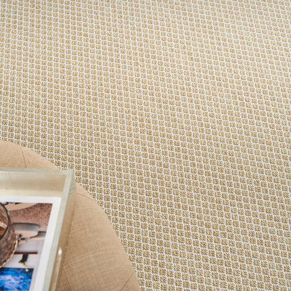 Beige woven fabric with tiny white grid pattern; round wooden placemat and photo frame visible in the corner.