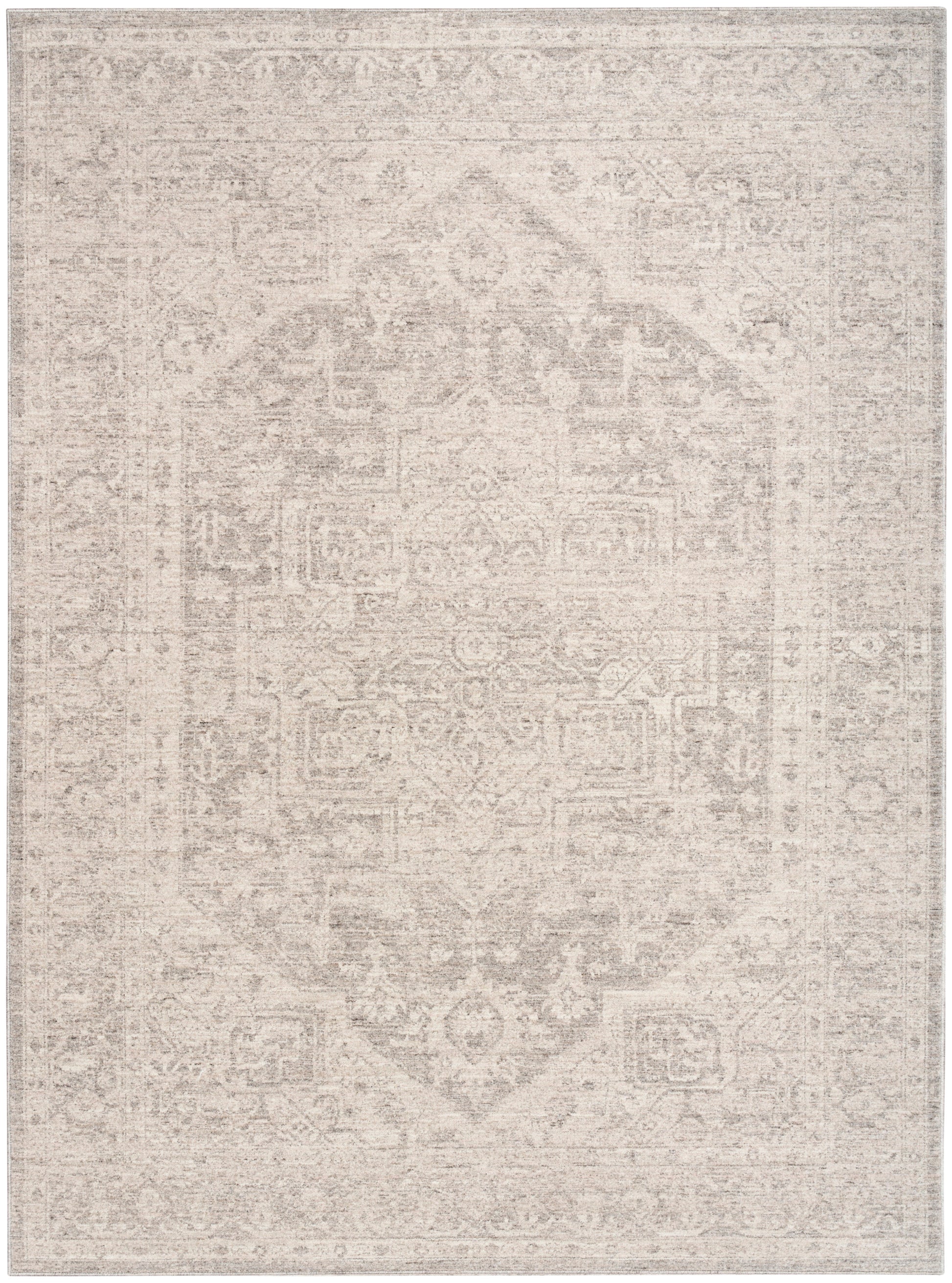 Rectangular rug with a faded beige-gray oriental pattern, central medallion, soft vintage look.