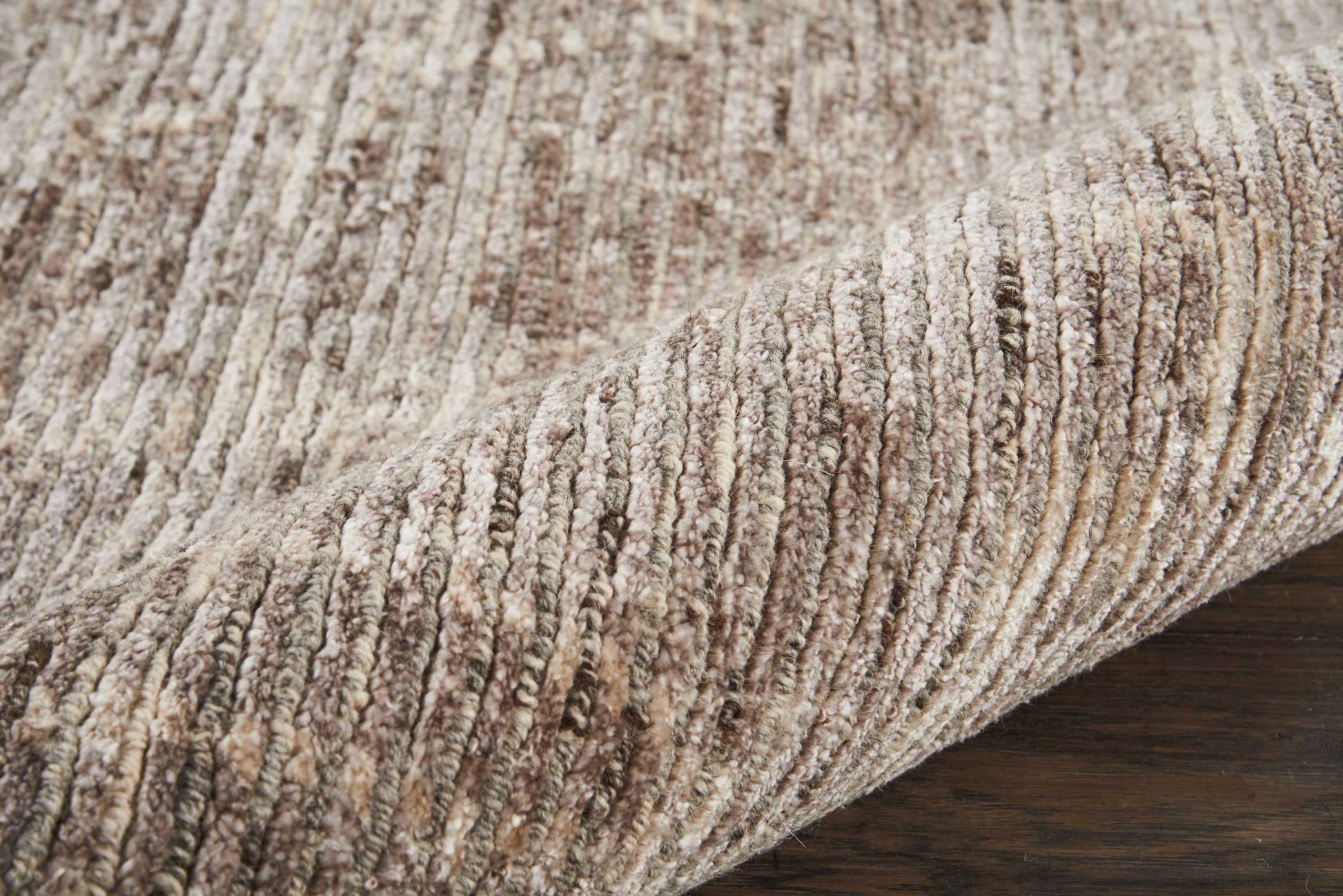 Beige-taupe ribbed textured rug with plush pile, cozy modern living-room accent.
