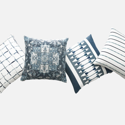 Blue & white decorative pillow with grid, ikat & striped patterns for sofa decor.