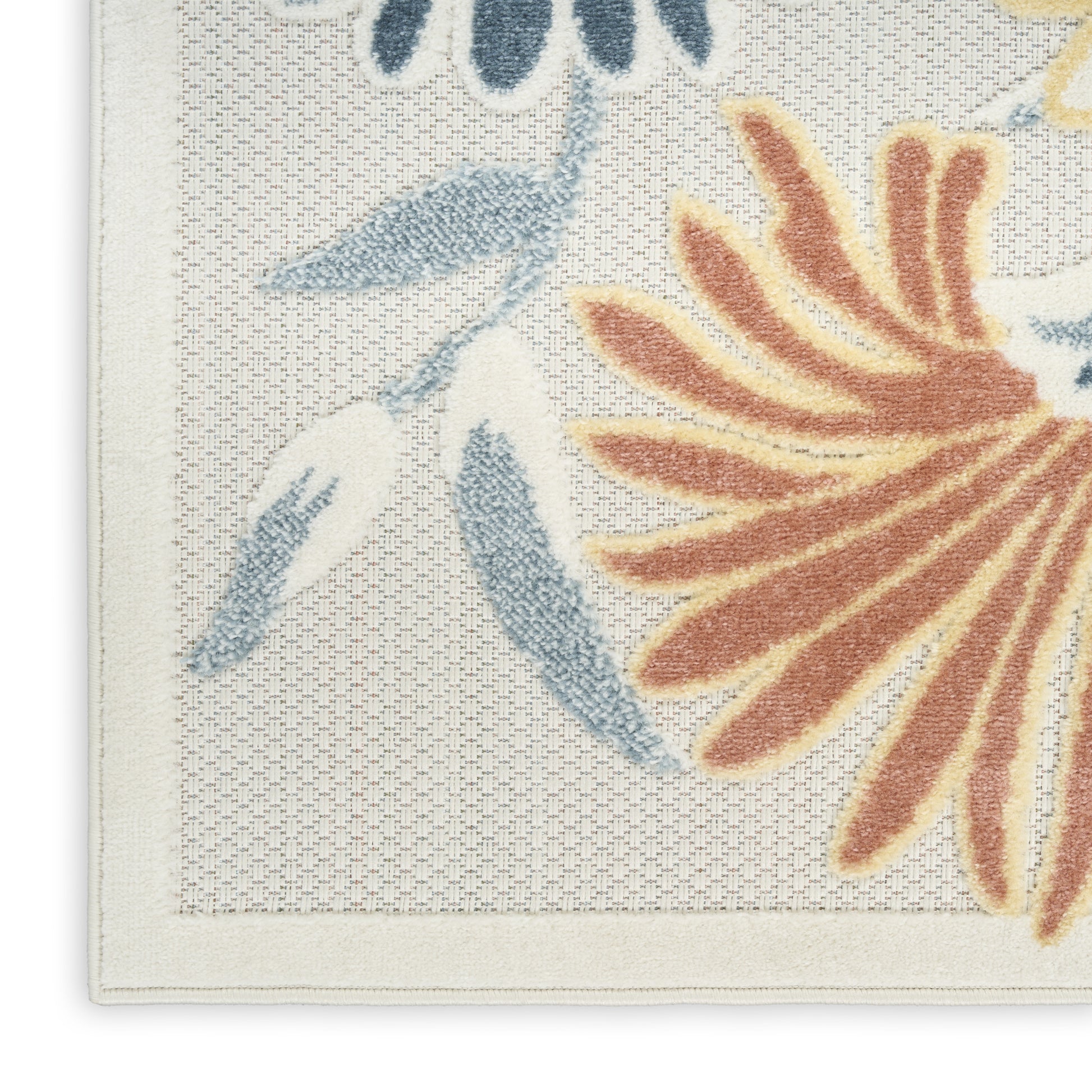 Cream outdoor rug featuring large orange-brown petals and blue leaves with a pale border.
