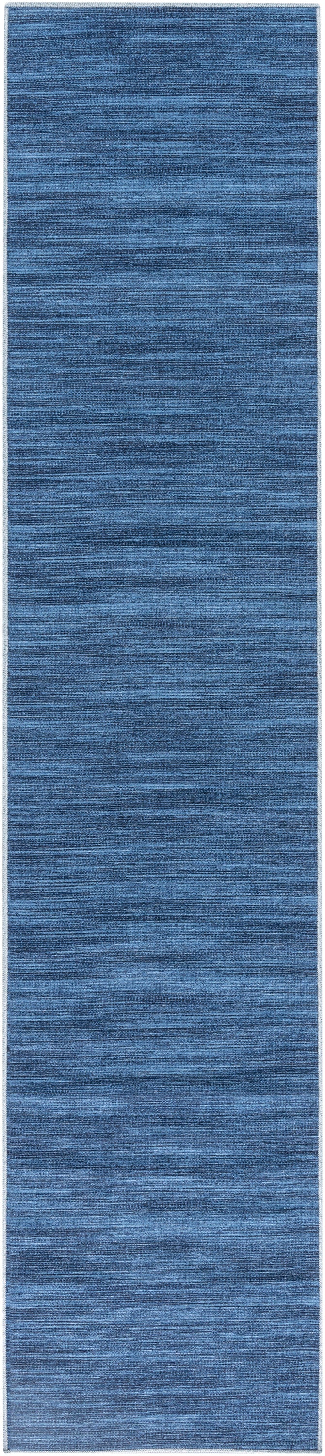 Denim blue textured runner rug with subtle horizontal striations and light border.
