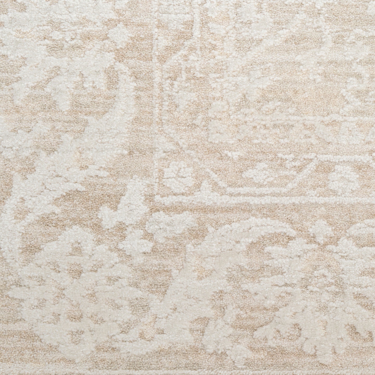 Beige and cream distressed oriental rug with floral medallion pattern and subtle border.
