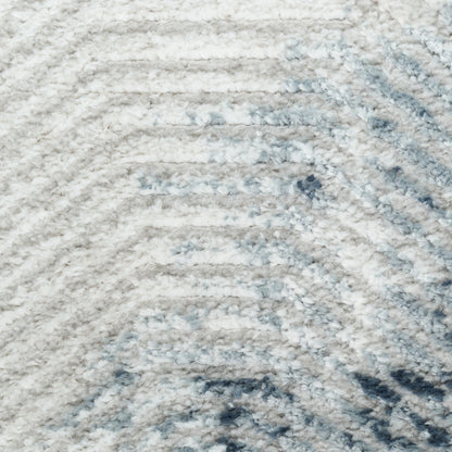 Cream and light gray shag rug with soft blue accents and a plush, wavy striped texture.