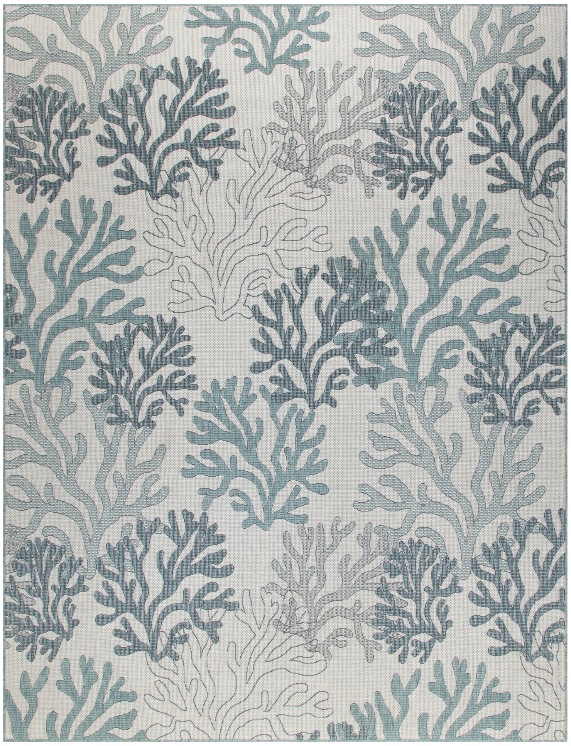 Patterned rug with sea coral silhouettes in teal and blue-gray on a pale background.
