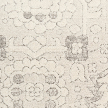 Cream rectangular area rug with subtle gray floral and geometric motifs in a textured pattern.