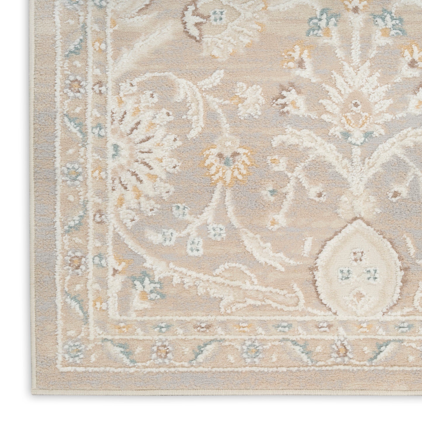 Beige traditional floral rug with light blue and ivory motifs, ornate border and distressed look, ideal living room accent.