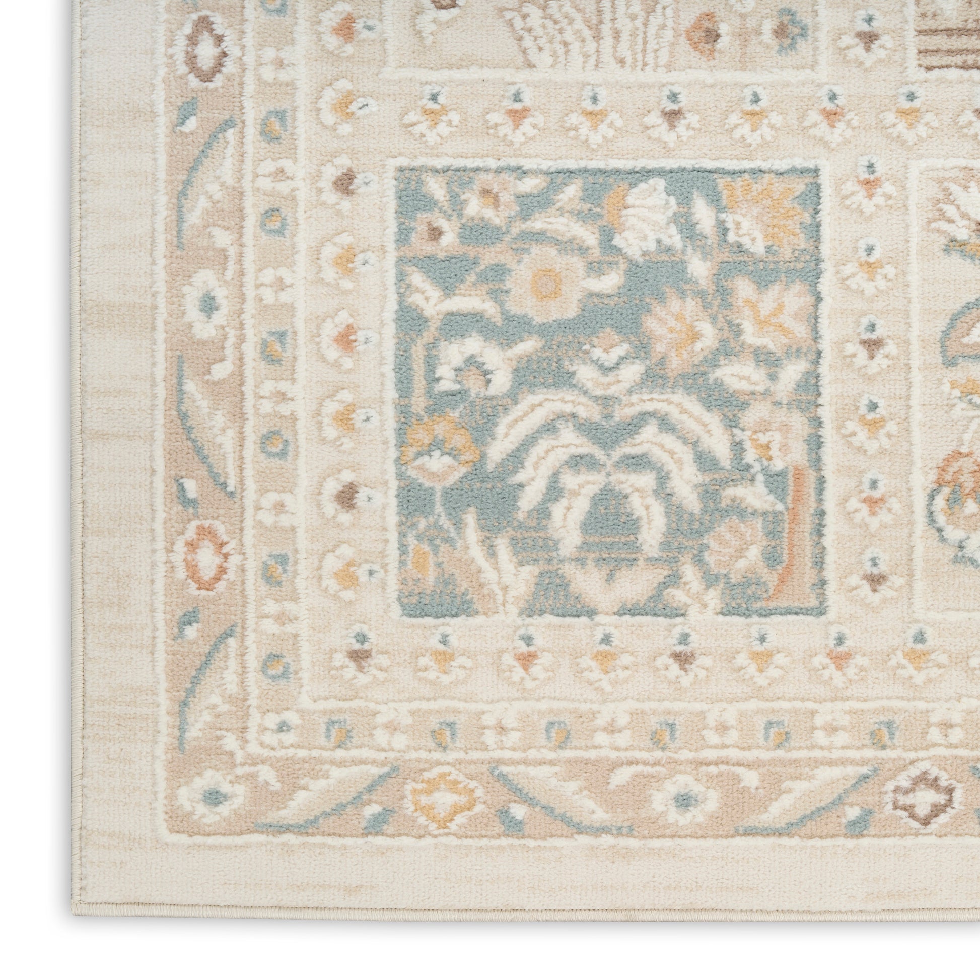 Traditional oriental rug with ivory & beige border, pale blue central field and floral motifs in cream & peach.