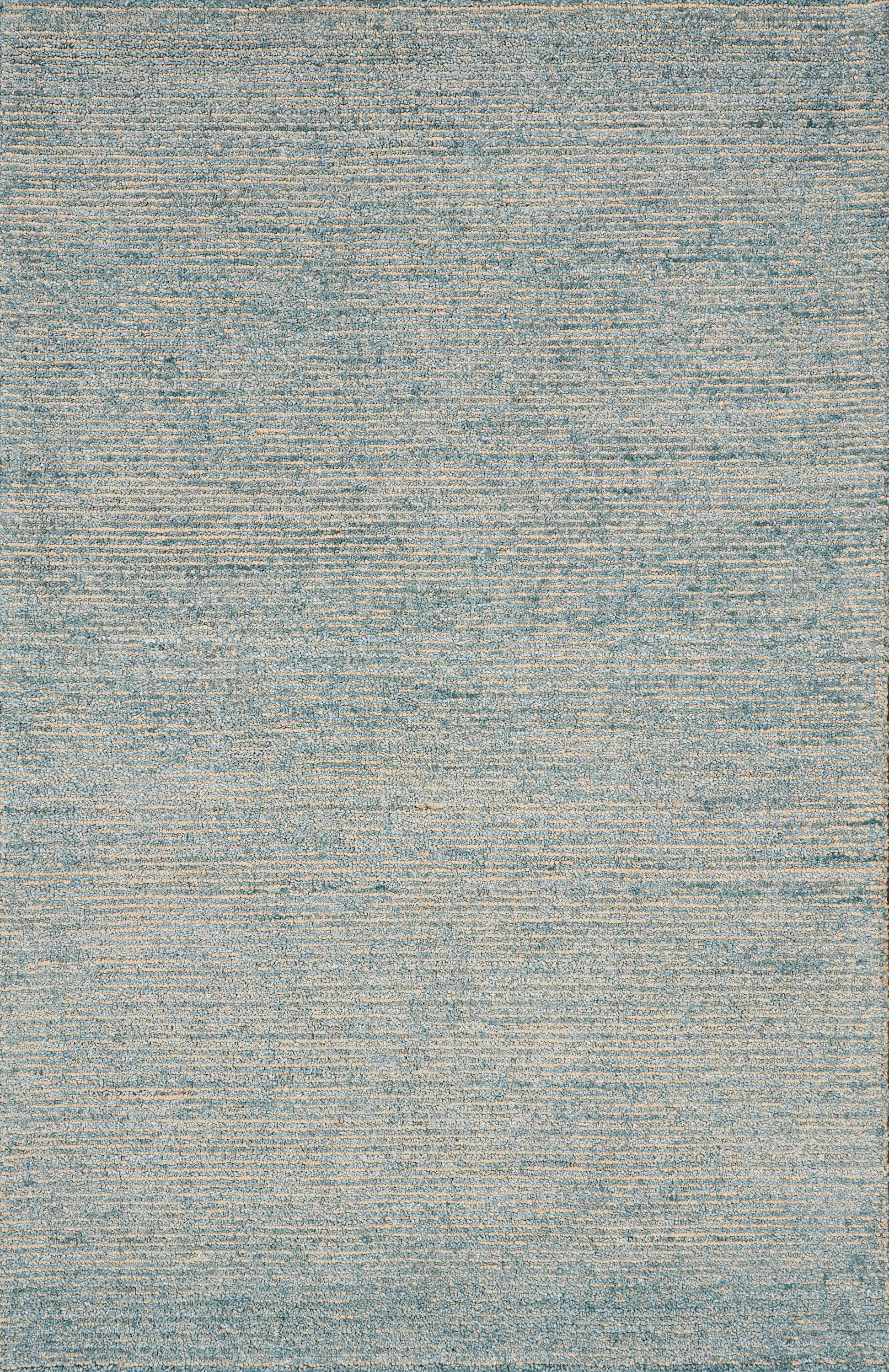 Rectangular flat-weave rug in blue and beige tones with subtle distressed texture, contemporary living room accent.