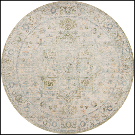 Round area rug with a faded antique medallion motif in cream, pale blue and gray.