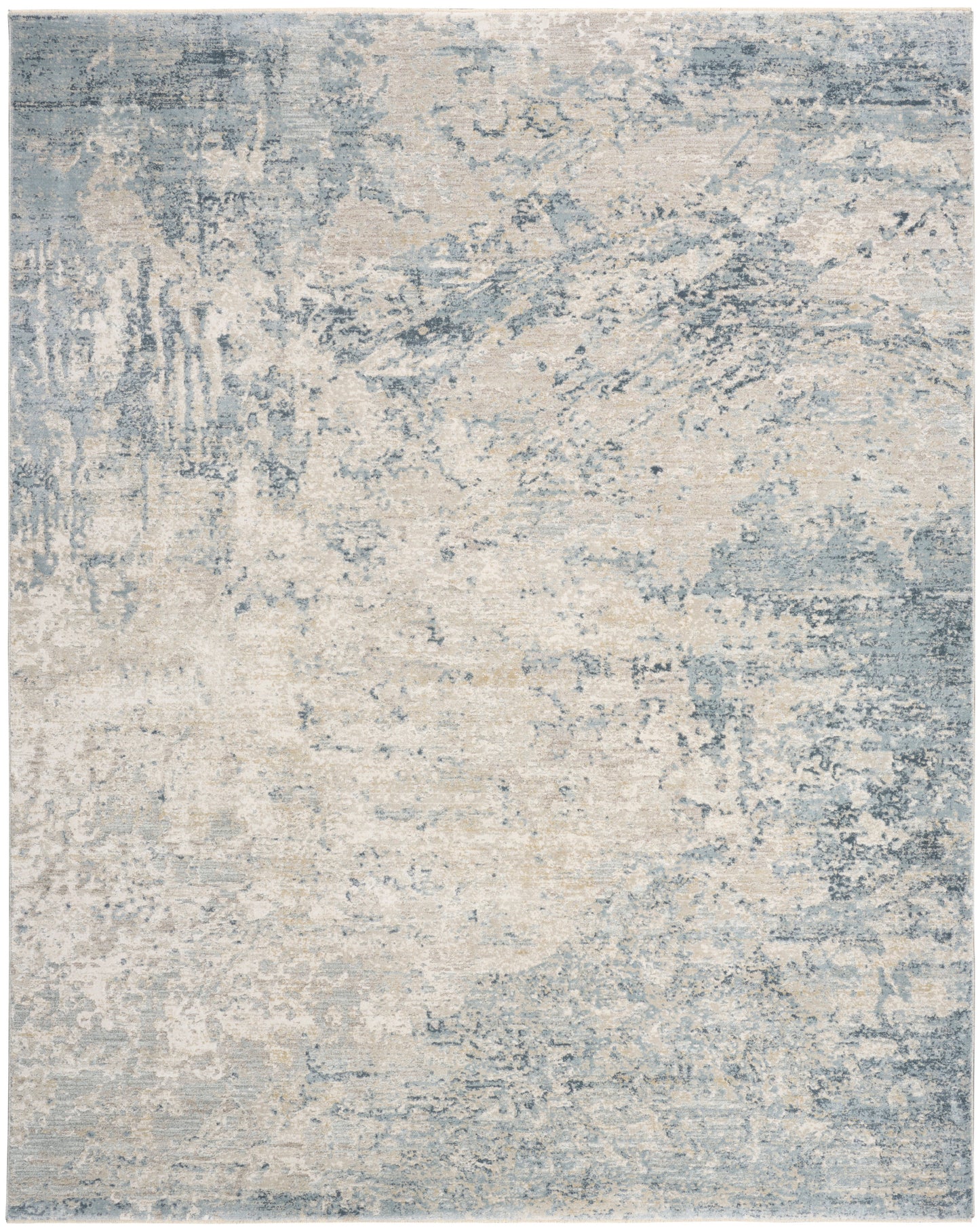 Abstract distressed area rug in muted blue and cream tones with a vintage watercolor look.