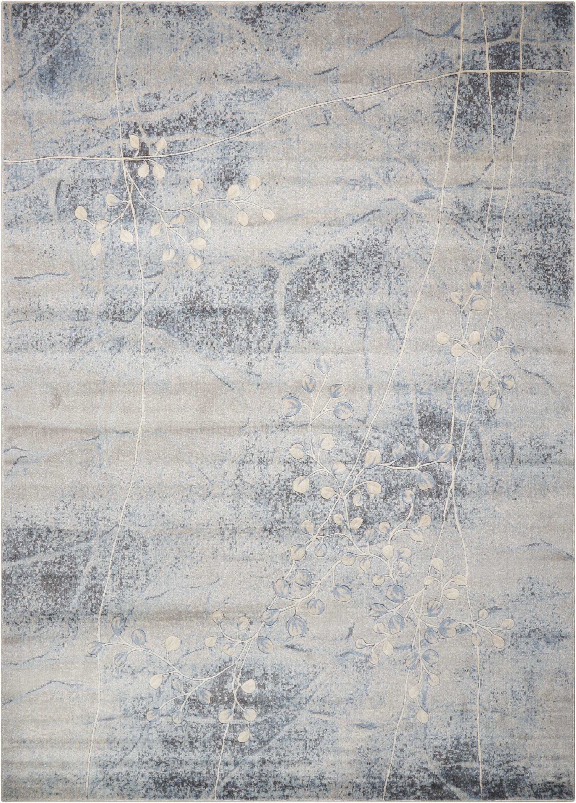 Blue-gray abstract area rug with pale white vine and leaf motifs on a marbled background; modern decorative rug.
