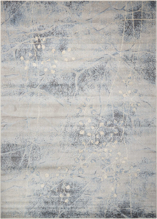Blue-gray abstract area rug with pale white vine and leaf motifs on a marbled background; modern decorative rug.