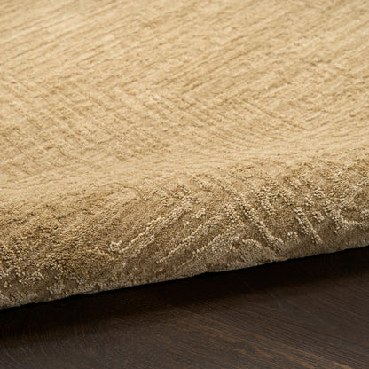 Beige textured rug with soft pile and rolled edge, woven pattern, on dark wood floor.