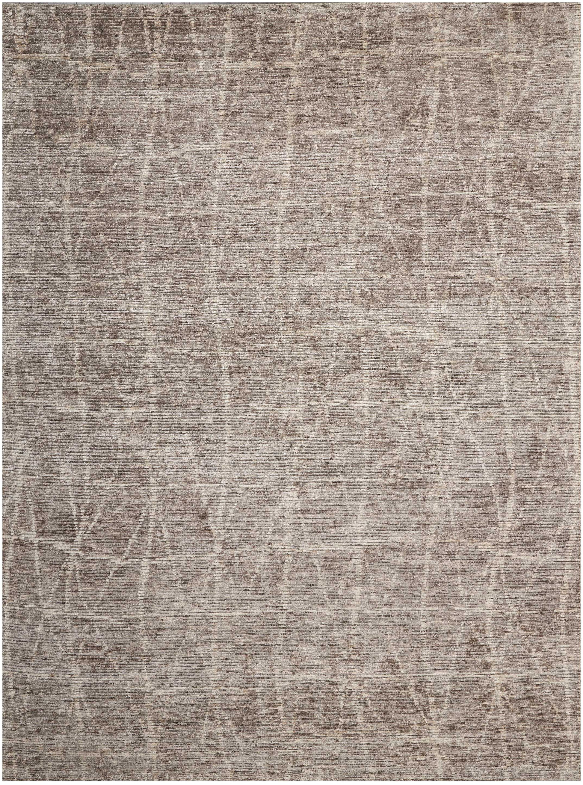 Taupe woven area rug with soft texture and subtle abstract geometric lattice pattern.