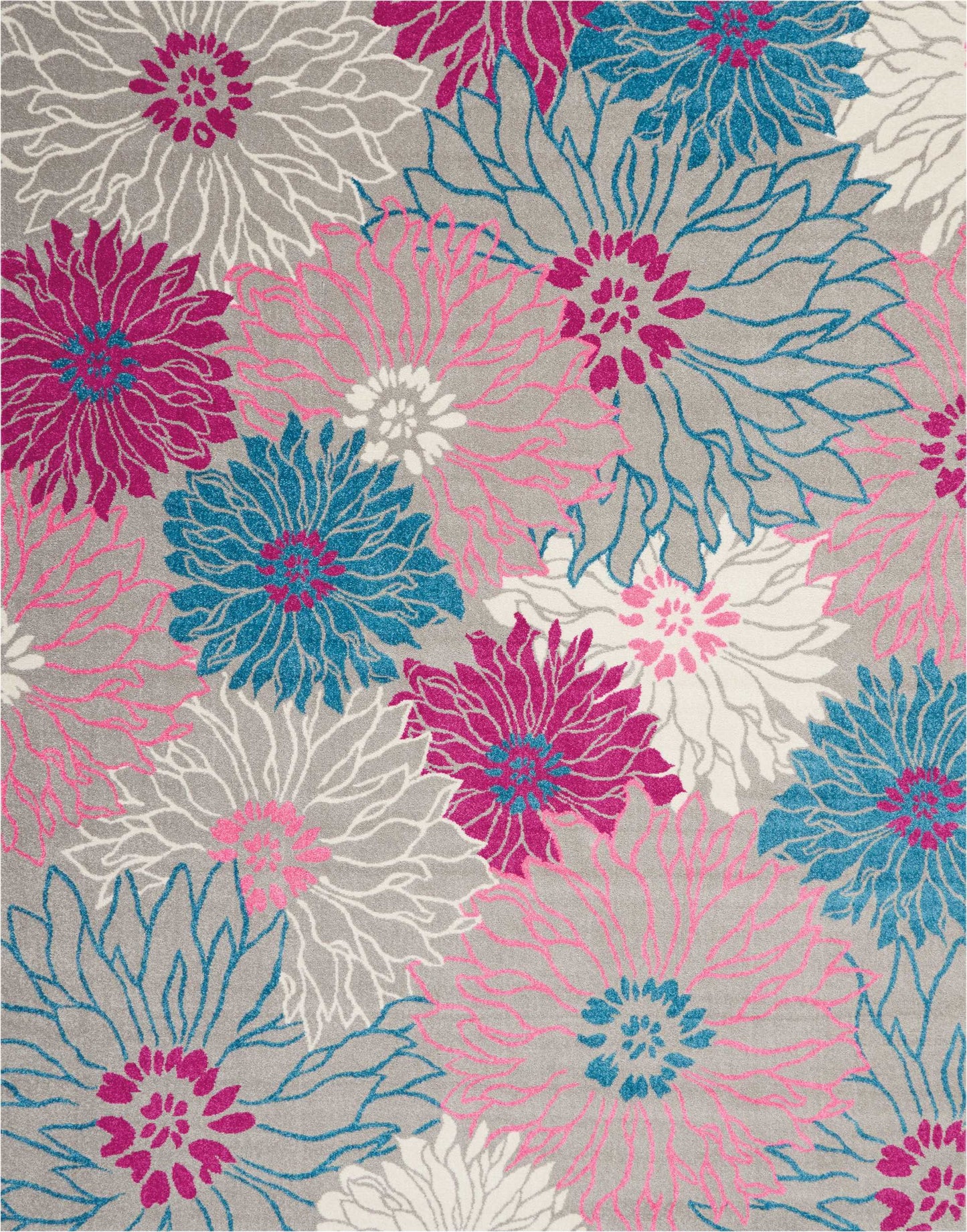 Colorful floral rug with oversized petals in pink, teal, magenta and white on a gray background.