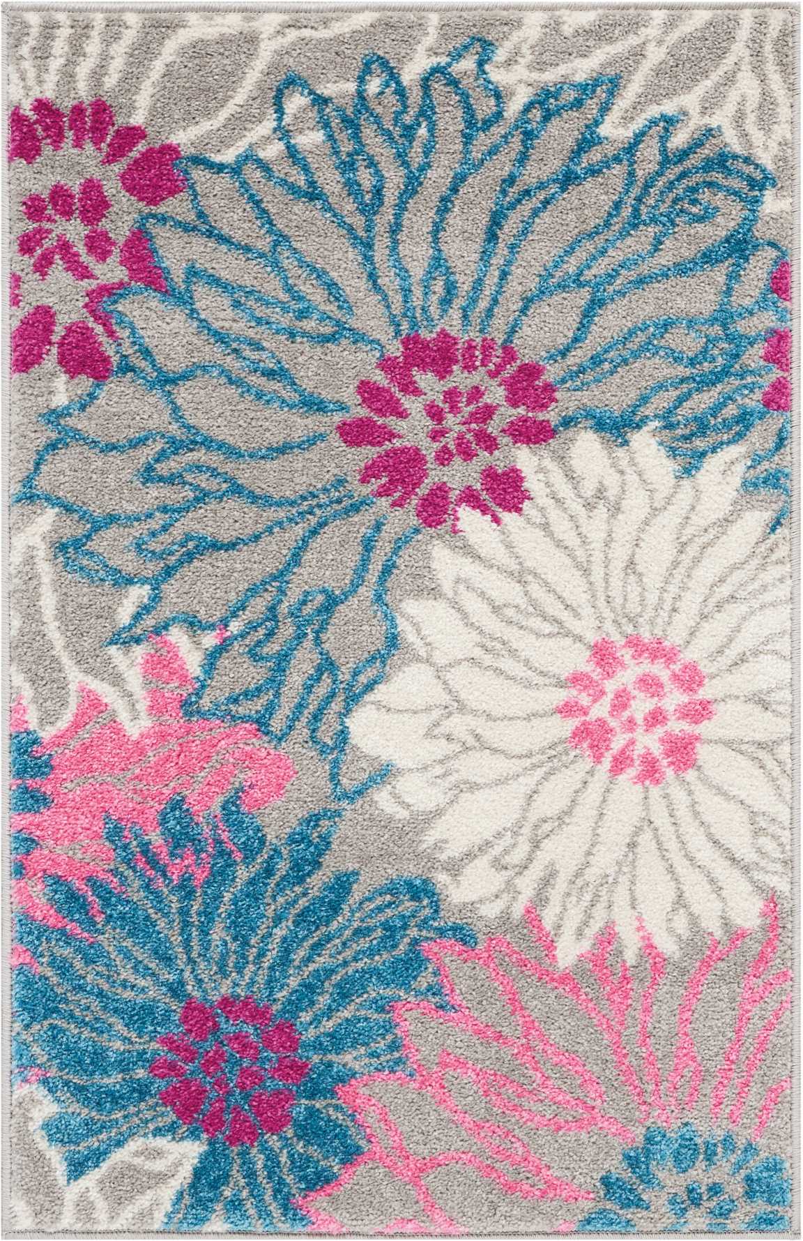 Shaggy area rug with oversized daisy-like blooms in teal blue, white, and hot pink on light gray.